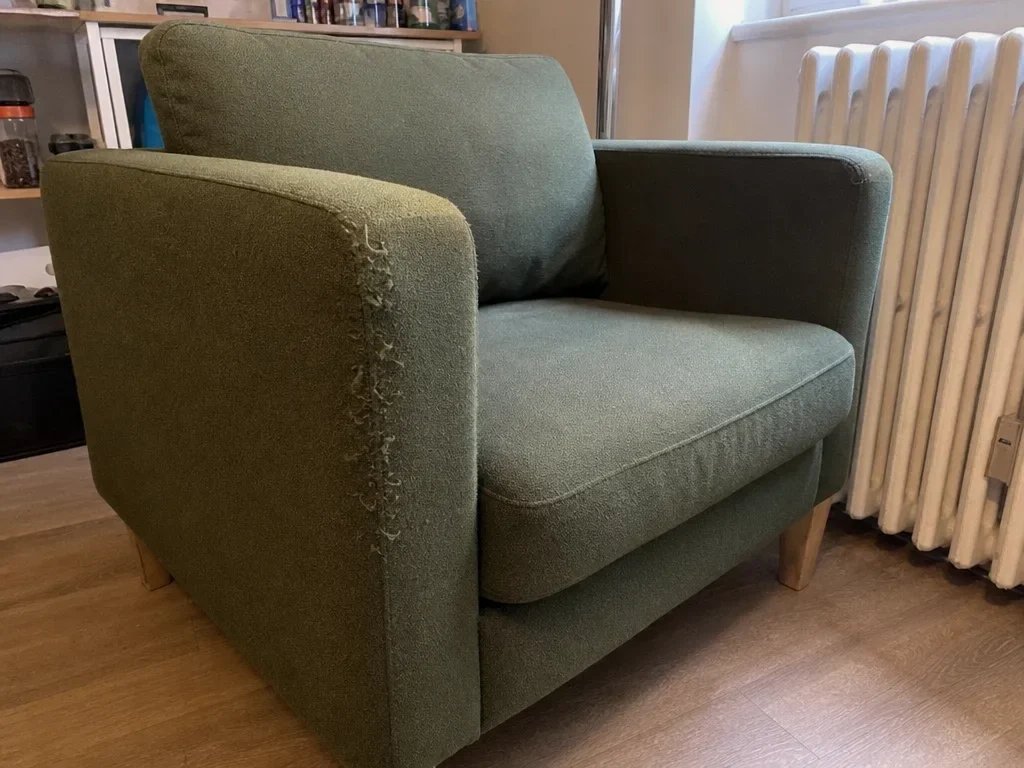 Green upholstered armchair image 1
