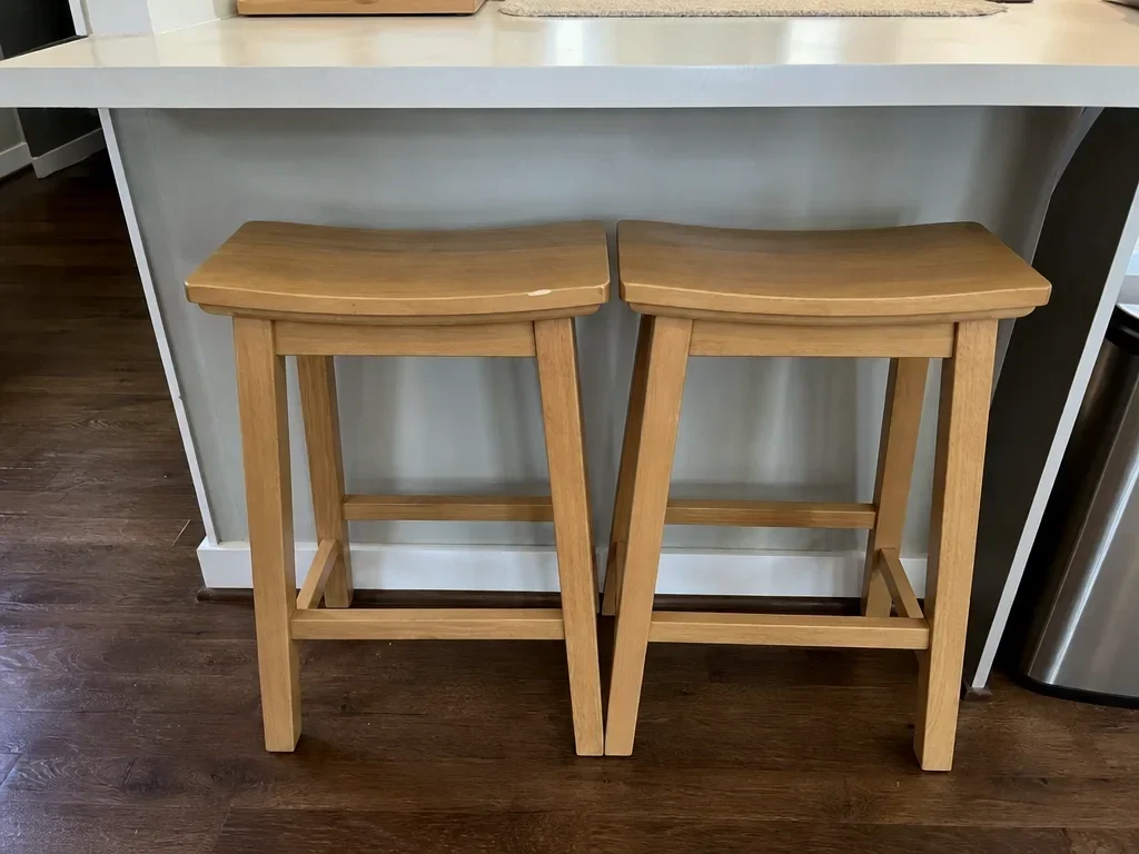 Two wood counter stools image 1
